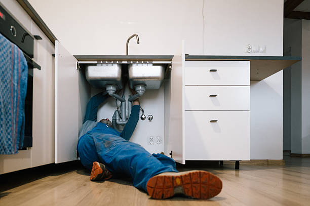 Professional Drain Cleaning technician working in Rowland, NC